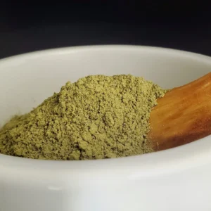 Raw Green Indo kratom powder from batch 15509 displayed in a bowl, showcasing its natural form and vibrant color.