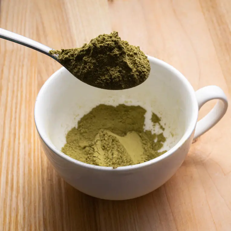 What to know about the different types of kratom. Kratom powder on a spoon and in a tea cup