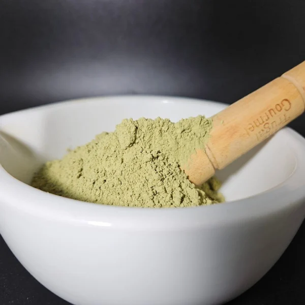 Green Vietnam kratom powder, batch 151318, presented in an apothecary bowl.