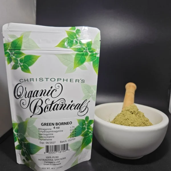 Green Borneo kratom powder and packaging labeled with batch number 152703.